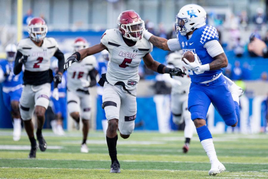 Kentucky running back LaVell Wright (29) pushes off a defensive player during the Kentucky vs. New Mexico State football game on Saturday, Nov. 20, 2021, at Kroger Field in Lexington, Kentucky. UK won 56-16. Photo by Jack Weaver | Staff