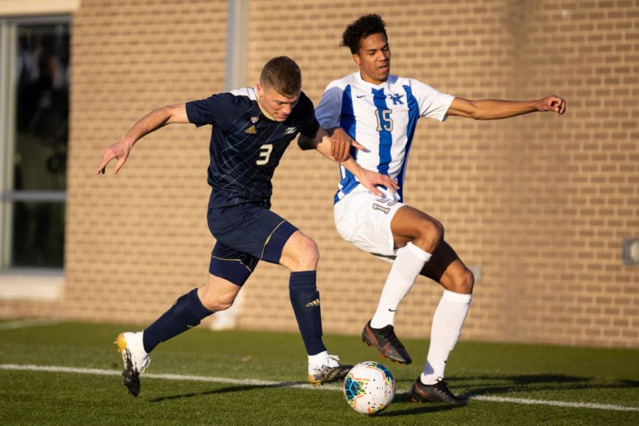 Kentucky Wildcats forward Brock Lindow (15) fights for possession during the University of Kentucky vs. Akron mens soccer game on Thursday, Feb. 25, 2021, at Wendell and Vickie Bell Soccer Complex in Lexington, Kentucky. UK and Akron tied 1-1. Photo by Michael Clubb | Staff