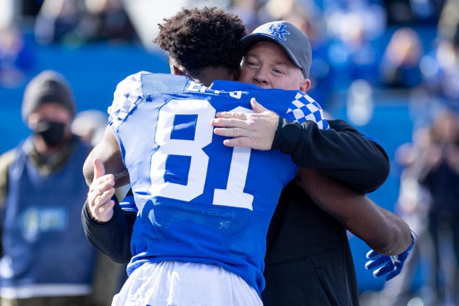 Kentucky wide receiver Isaiah Epps (81) hugs Kentucky head coach Mark Stoops during a senior celebration before the Kentucky vs. New Mexico State football game on Saturday, Nov. 20, 2021, at Kroger Field in Lexington, Kentucky. UK won 56-16. Photo by Jack Weaver | Staff