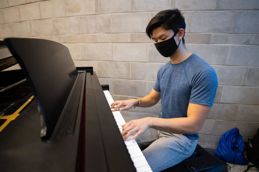 Norman Chan, a second-year psychology major, plays the piano in the Gatton Student Center on Wednesday, Nov. 10, 2021, in Lexington, Kentucky. Photo by Michael Clubb | Staff