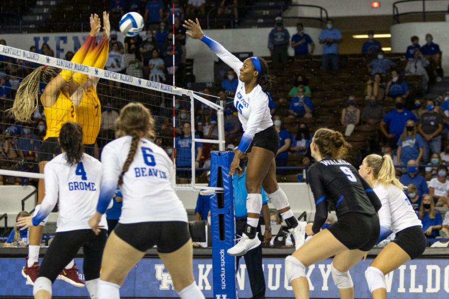 Kentucky Wildcats middle blocker Azhani Tealer (15) hits the ball during UK volleyball’s game against Southern California on Saturday, Sept. 4, 2021, at Memorial Coliseum in Lexington, Kentucky. UK won 3-0. Photo by Jack Weaver | Staff
