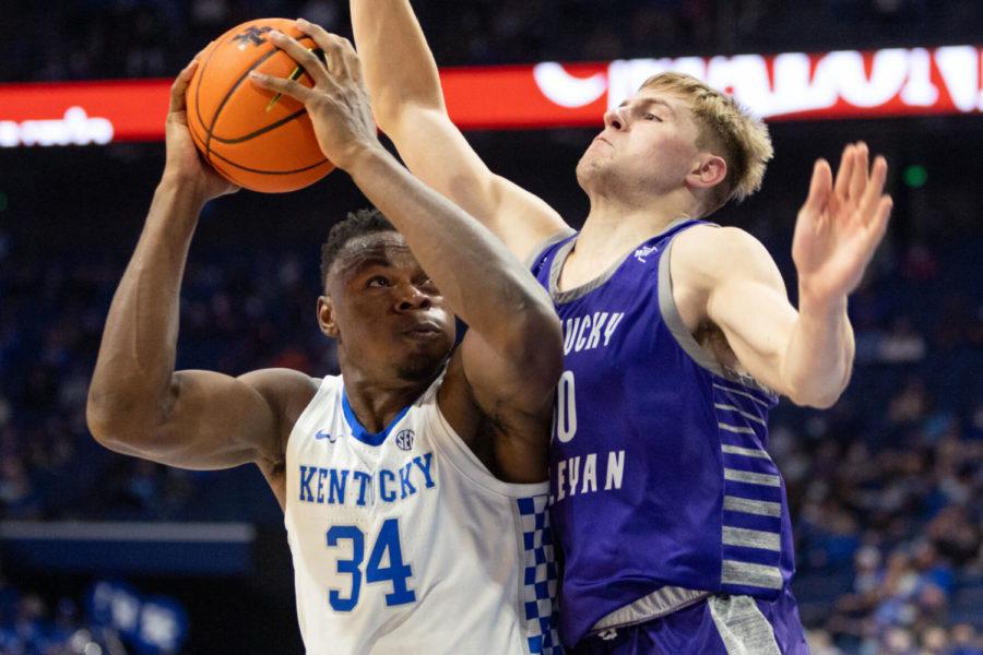 Kentucky+Wildcats+forward+Oscar+Tshiebwe+%2834%29+fights+off+a+defender+while+shooting+the+ball+during+the+UK+vs.+Wesleyan+exhibition+game+on+Friday%2C+Oct.+29%2C+2021%2C+at+Rupp+Arena+in+Lexington%2C+Kentucky.+UK+won+95-72.+Photo+by+Jack+Weaver+%7C+Staff