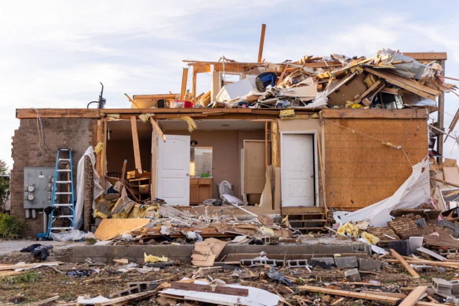 The remains of a home are scattered with debris following a tornado on Saturday, Dec. 11, 2021, on Creekwood Avenue in Bowling Green, Kentucky. Photo by Jack Weaver | Staff