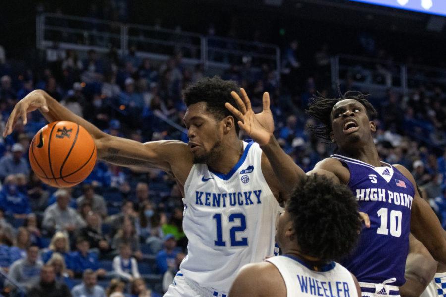 Kentucky Wildcats forward Keion Brooks Jr. (12) attempts to keep control of the ball during the University of Kentucky vs. High Point basketball game on Friday, Dec. 31, 2021, at Rupp Arena in Lexington, Kentucky. Photo by Jackson Dunavant | Staff