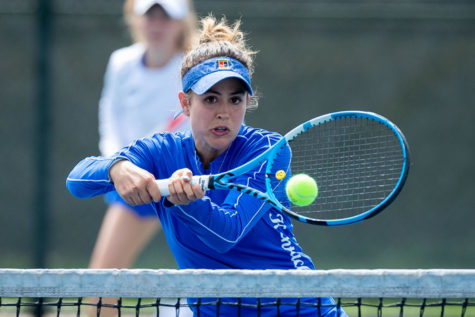 Carla Girbau hits the ball across the net during the University of Kentucky vs. Tennessee women’s tennis match on Sunday, March 28, 2021, at Hillary J. Boone Tennis Center in Lexington, Kentucky. Photo by Michael Clubb | Staff
