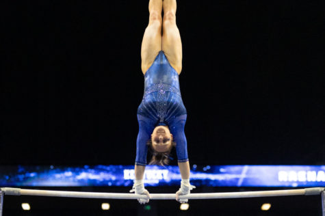 Kentucky junior Raena Worley performs on the bars during Kentucky gymnastics’ season opener against Ball State on Friday, Jan. 14, 2022, at Rupp Arena in Lexington, Kentucky. UK won 196.525-194.750. Photo by Jack Weaver | Staff