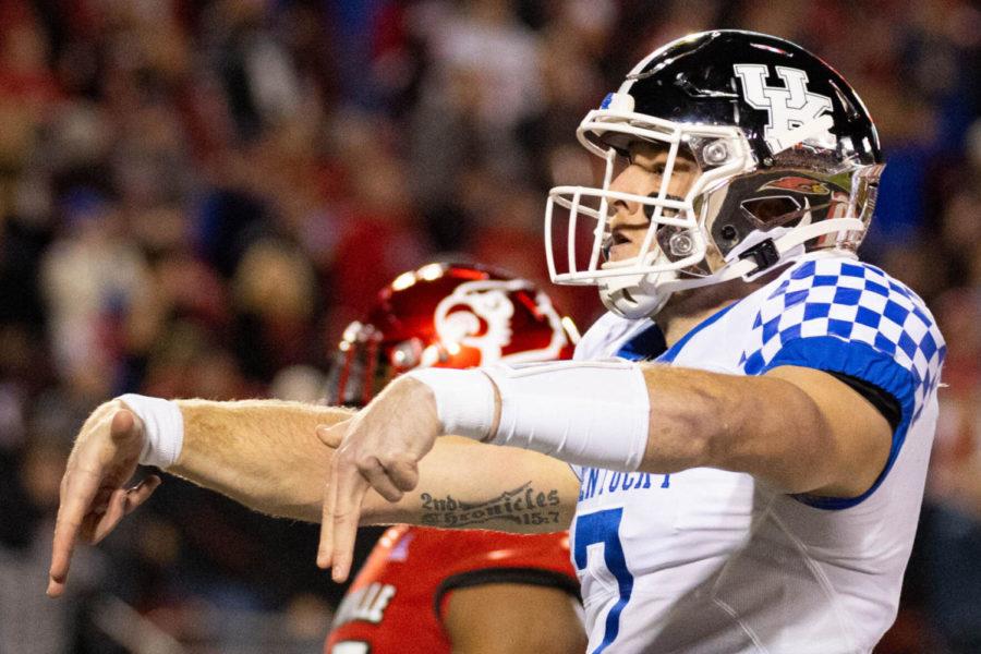 Kentucky Wildcats quarterback Will Levis (7) gives the “L’s down” signal after scoring a touchdown during the UK vs. Louisville football game on Saturday, Nov. 27, 2021, at Cardinal Stadium in Louisville, Kentucky. Photo by Michael Clubb | Staff