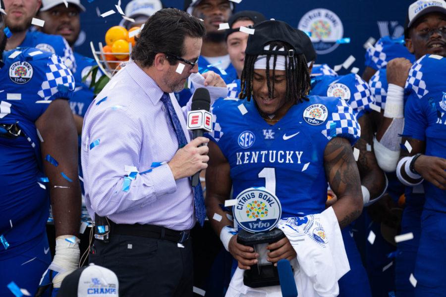 Kentucky Wildcats wide receiver WanDale Robinson (1) receives his MVP award for the UK vs Iowa VRBO Citrus Bowl football game on Saturday, Jan. 1, 2022, at Camping World Stadium in Orlando, Florida. UK won 20-17. Photo by Michael Clubb | Staff