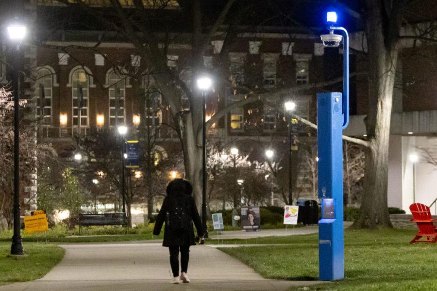 A UK student walks past a blue light tower outside White Hall Classrooms Building on Wednesday, Jan. 12, 2022, at the University of Kentucky in Lexington, Kentucky. Photo by Jack Weaver | Staff