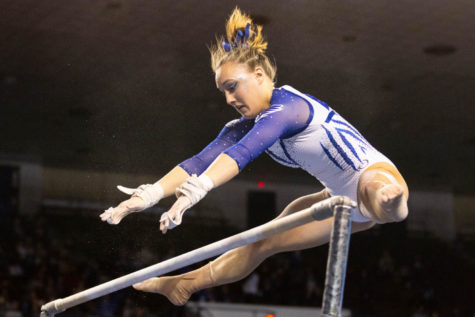Raena Worley performs her bars routine during the Florida vs. Kentucky gymnastics meet on Friday, Feb. 18, 2022, at Memorial Coliseum in Lexington, Kentucky. UK lost 197.350-97.575. Photo by Michael Clubb | Staff