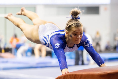Makenzie Wilson launches over the vault during the Florida vs. Kentucky gymnastics meet on Friday, Feb. 18, 2022, at Memorial Coliseum in Lexington, Kentucky. UK lost 197.350-97.575. Photo by Michael Clubb | Staff