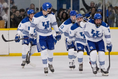 Kentucky players celebrate after scoring a goal during the UK vs. Louisville hockey game on Saturday, Jan. 22, 2022, at Lexington Ice Center in Lexington, Kentucky. UK lost 7-5. Photo by Jack Weaver | Staff