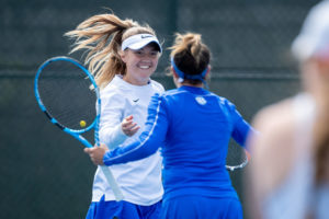 Elizabeth Stevens high fives Carla Girbau after scoring a point during the University of Kentucky vs. Tennessee women’s tennis match on Sunday, March 28, 2021, at Hillary J. Boone Tennis Center in Lexington, Kentucky. Photo by Michael Clubb | Staff