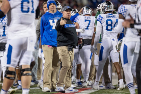 Kentucky Wildcats head coach Mark Stoops celebrates after a rushing touchdown by Kentucky Wildcats quarterback Will Levis (7) during the Kentucky vs. Louisville football game on Saturday, Nov. 27, 2021, at Cardinal Stadium in Louisville, Kentucky. UK won 52-21. Photo by Jack Weaver | Staff