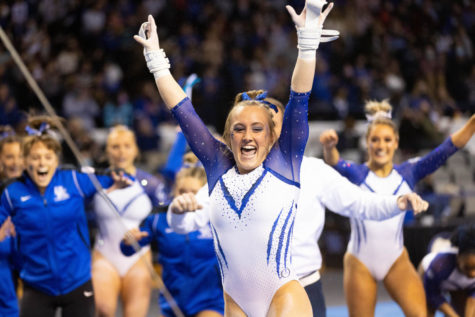 Raena Worley celebrates after her bars routine during the Florida vs. Kentucky gymnastics meet on Friday, Feb. 18, 2022, at Memorial Coliseum in Lexington, Kentucky. UK lost 197.350-97.575. Photo by Michael Clubb | Staff