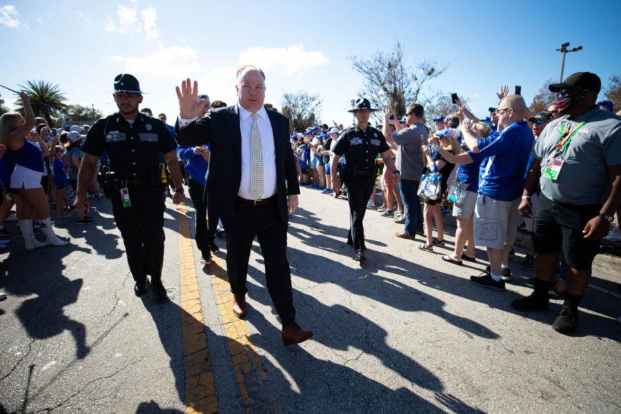 Kentucky Wildcats head coach Mark Stoops waves to fans during Cat Walk before the UK vs Iowa VRBO Citrus Bowl football game on Saturday, Jan. 1, 2022, at Camping World Stadium in Orlando, Florida. Photo by Michael Clubb | Staff