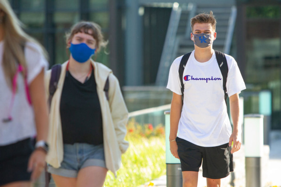 A student wearing a mask exits Gatton Student Center on the first day of in-person classes on Monday, Aug. 17, 2020, in Lexington, Kentucky. Photo by Jack Weaver | Staff