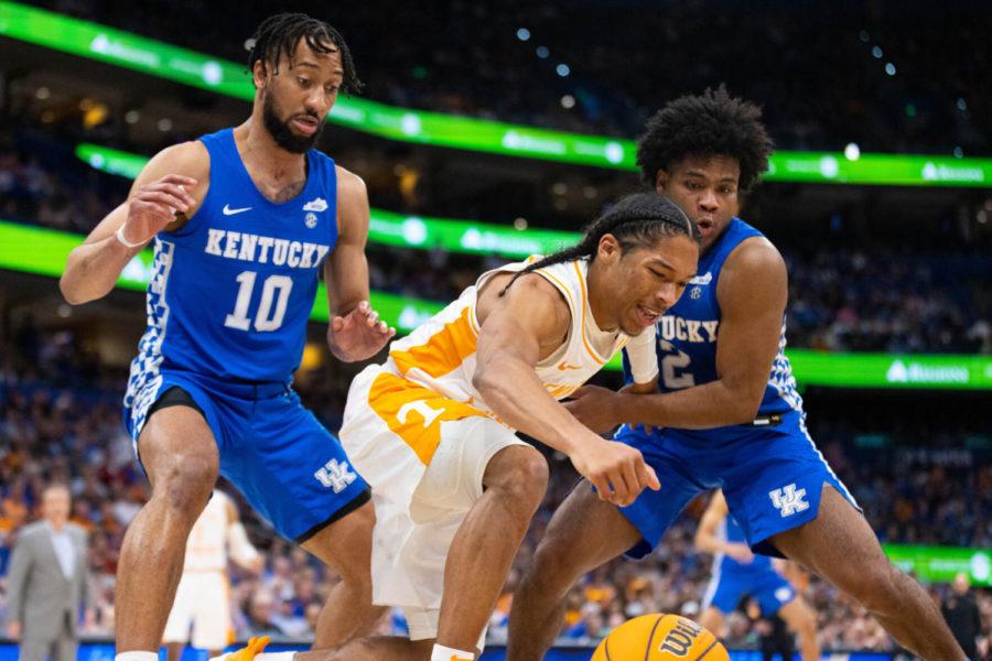 Tennessee Volunteers guard Zakai Zeigler (5) reaches for loose ball during the UK vs. Tennessee SEC Tournament semifinal mens basketball game on Saturday, March 12, 2022, at Amalie Arena in Tampa, Florida. UK lost 69-62. Photo by Michael Clubb | Staff