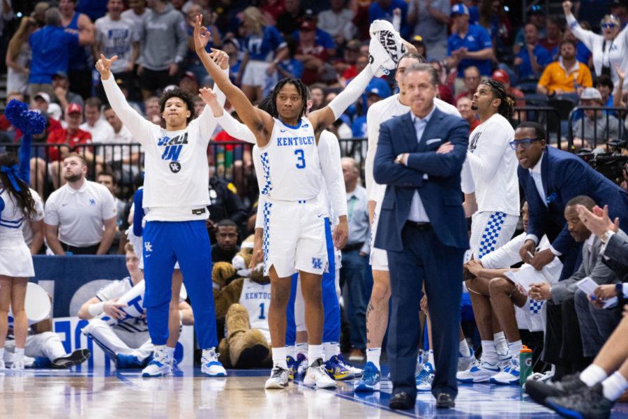 Kentucky Wildcats guard TyTy Washington Jr. (3) celebrates a teammates 3-pointer during the UK vs. Vanderbilt SEC Tournament quarterfinals mens basketball game on Friday, March 11, 2022, at Amalie Arena in Tampa, Florida. UK won 77-71. Photo by Michael Clubb | Staff