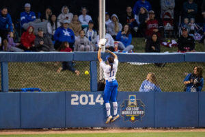 Kentucky outfielder Vanessa Nesby (11) jumps on the outfield wall on a home run during the UK vs. Oklahoma softball game on Tuesday, March 22, 2022, at John Cropp Stadium in Lexington, Kentucky. Oklahoma won 9-1. Photo by Jack Weaver | Staff