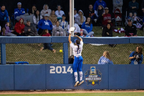 Kentucky outfielder Vanessa Nesby (11) jumps on the outfield wall on a home run during the UK vs. Oklahoma softball game on Tuesday, March 22, 2022, at John Cropp Stadium in Lexington, Kentucky. Oklahoma won 9-1. Photo by Jack Weaver | Staff