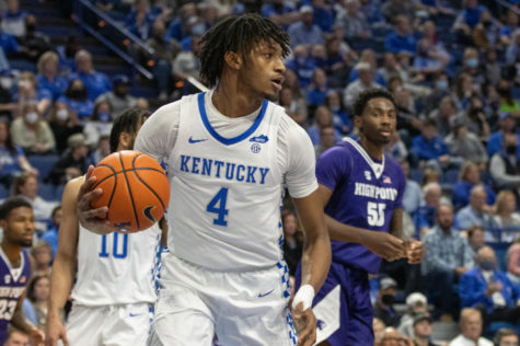 Kentucky Wildcats forward Daimion Collins (4) secures a rebound during the University of Kentucky vs. High Point basketball game on Friday, Dec. 31, 2021, at Rupp Arena in Lexington, Kentucky. Photo by Jackson Dunavant | Staff