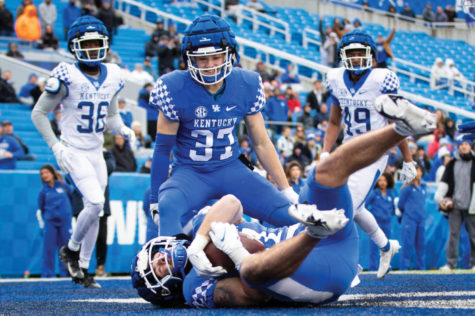 Kentucky Wildcats wide receiver Cole Lanter (81) scores a touchdown as wide receiver Luke Leeper (37) celebrates in the background during the UK football spring game on Saturday, April 9, 2022, at Kroger Field in Lexington, Kentucky. Photo by Michael Clubb | Staff