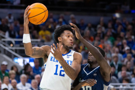 Kentucky Wildcats forward Keion Brooks Jr. (12) passes the ball during the UK vs. Saint Peter’s mens basketball game in the first round of the NCAA Tournament on Thursday, March 17, 2022, at Gainbridge Arena in Indianapolis, Indiana. UK lost 85-79 in overtime. Photo by Michael Clubb | Staff