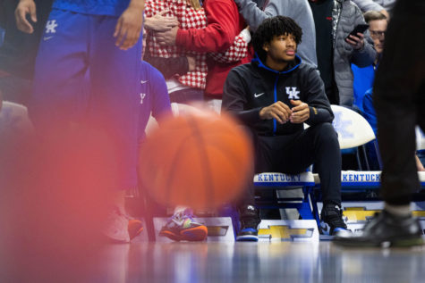 Kentucky Wildcats guard Shaedon Sharpe sits on the bench during warmups before the UK vs Georgia men’s basketball game on Saturday, Jan. 8, 2022, at Rupp Arena in Lexington, Kentucky. UK won 92-77. Photo by Michael Clubb | Staff