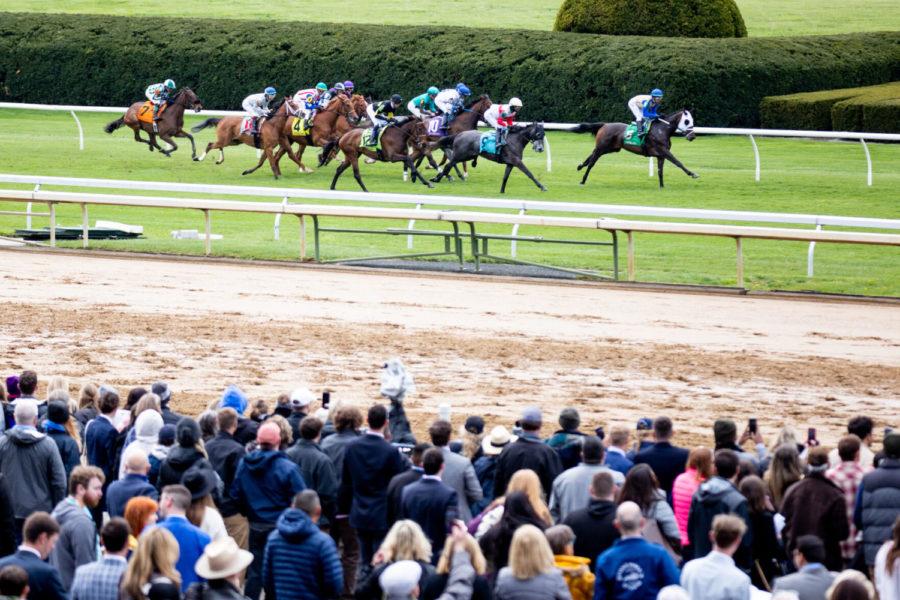 Spectators watch a race during the first day of the Spring Meet on Friday, April 8, 2022, at Keeneland in Lexington, Kentucky. Photo by Jack Weaver | Staff