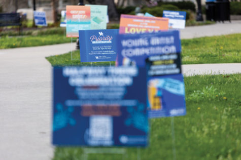 Yard signs line a sidewalk outside White Hall Classroom Building on Wednesday, April 13, 2022, in Lexington, Kentucky. Photo by Jack Weaver | Staff