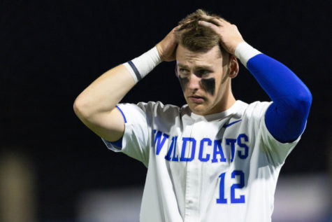 Kentucky Wildcats infielder Chase Estep (12) fixes his hair during the UK vs. Morehead State baseball game on Tuesday, March 22, 2022, at Kentucky Proud Park in Lexington, Kentucky. UK won 7-5. Photo by Michael Clubb | Staff