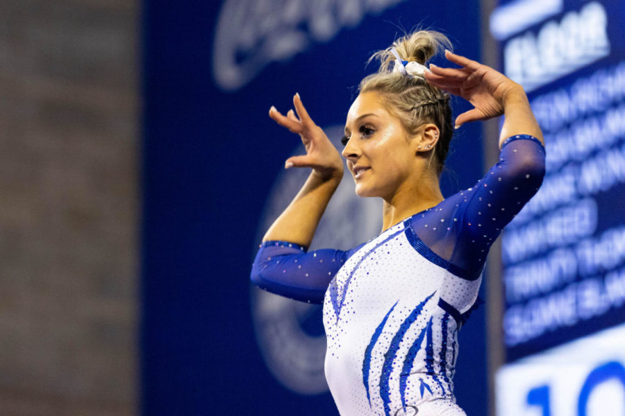 Isabella Magnelli strikes a pose during her beam routine during the Florida vs. Kentucky gymnastics meet on Friday, Feb. 18, 2022, at Memorial Coliseum in Lexington, Kentucky. UK lost 197.350-97.575. Photo by Michael Clubb | Staff