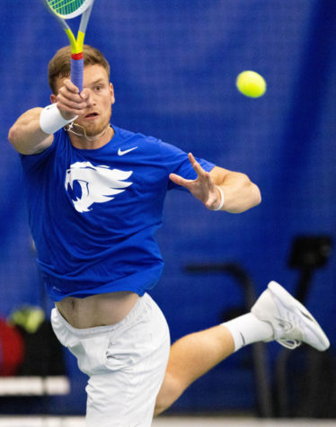 Millen Hurrion hits the ball during the UK vs. Virginia tennis match on Thursday, March 31, 2022, at Hilary J. Boone Tennis Complex in Lexington, Kentucky. UK lost 4-2. Photo by Michael Clubb | Staff