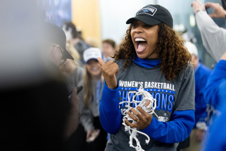 Kentucky Wildcats head coach Kyra Elzy celebrates with fans during the team’s return from the SEC Tournament championship game on Sunday, March 6, 2022, at Joe Craft Center in Lexington, Kentucky. UK defeated No. 1 South Carolina 64-62 with a 3-pointer by Dre’Una Edwards in the last seconds of the game in Nashville, Tennessee. Photo by Michael Clubb | Staff