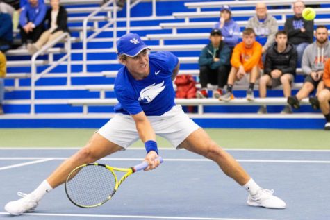 Liam Draxl celebrates winning a set during the UK vs. Virginia tennis match on Thursday, March 31, 2022, at Hilary J. Boone Tennis Complex in Lexington, Kentucky. UK lost 4-2.