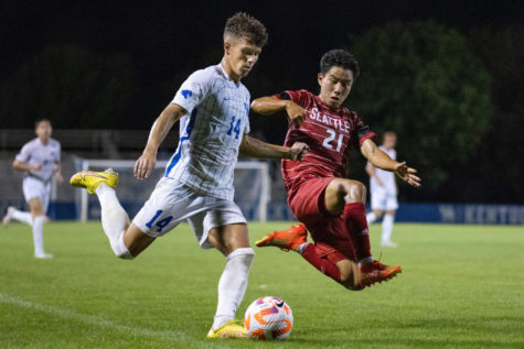 Kentucky Wildcats defender Max Miller (14) keeps the ball away from a defender during the Kentucky vs. Seattle mens soccer match on Monday, Aug. 29, 2022, at the Wendell and Vickie Bell Soccer Complex in Lexington, Kentucky. UK won 1-0. Photo by Jack Weaver | Staff