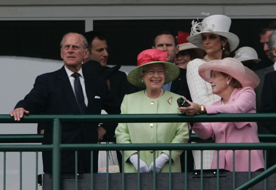 Queen Elizabeth, center, with Prince Phillip on left, watches a race with Will and Sarah Faris on Derby Day at Churchill Downs in Louisville, Kentucky, on Saturday, May 5, 2007. Photo by Charles Bertram | Lexington Herald Leader.