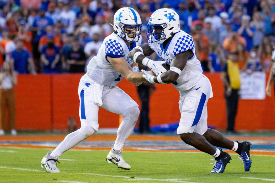 Kentucky Wildcats quarterback Will Levis (7) hands the ball off to running back Kavosiey Smoke (0) during the No. 20 Kentucky vs. No. 12 Florida football game on Saturday, Sept. 10, 2022, at Ben Hill Griffin Stadium in Gainesville, Florida. UK won 26-16. Photo by Jack Weaver | Kentucky Kernel