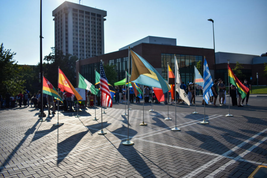 Several flags wave while students stand in line at the Eat Around the World SAB event on Friday, Sept. 16, 2022, at the University of Kentucky in Lexington, Kentucky. Photo by Abbey Cutrer | Staff