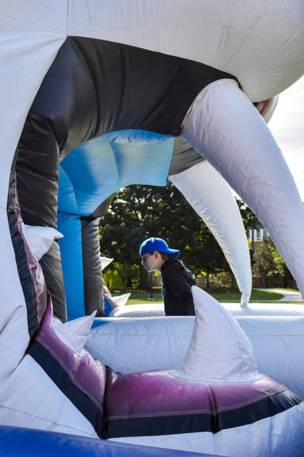 Kids play on an inflatable wildcat at the Bluegrass Biscuit Bash as a part of Family Weekend on Saturday, Sept. 24, 2022, at the University of Kentucky in Lexington, Kentucky. Photo by Abbey Cutrer | Staff