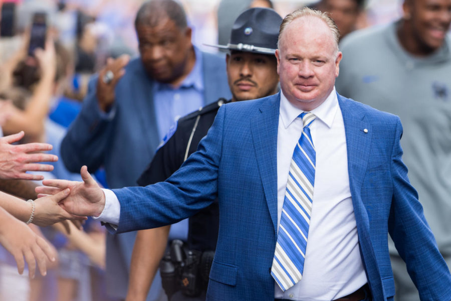 Kentucky Wildcats head coach Mark Stoops high fives a fan during Cat Walk before the Kentucky vs. Miami Ohio football game on Saturday, Sept. 3, 2022, at Kroger Field in Lexington, Kentucky. Photo by Isabel McSwain | Kentucky Kernel