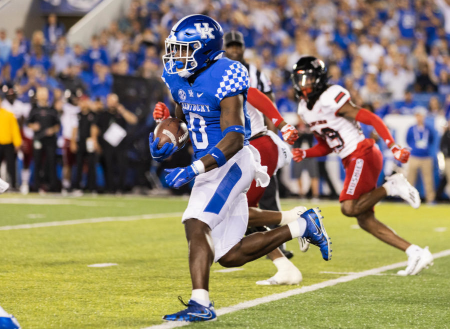 Kentucky Wildcats running back Kavosiey Smoke (0) runs down the field for a first down during the No. 8 Kentucky vs. Northern Illinois football game on Saturday, Sept. 24, 2022, at Kroger Field in Lexington, Kentucky. Kentucky won 31-23. Photo by Isabel McSwain | Staff