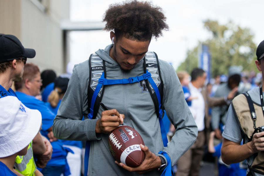 Kentucky Wildcats wide receiver Dane Key (6) signs a fan’s football during Cat Walk before the Kentucky vs. Miami Ohio football game on Saturday, Sept. 3, 2022, at Kroger Field in Lexington, Kentucky. Photo by Isabel McSwain | Staff