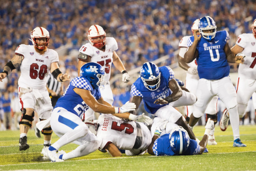 Kentucky players make a tackle during the Kentucky vs. Miami Ohio football game on Saturday, Sept. 3, 2022, at Kroger Field in Lexington, Kentucky. Photo by Isabel McSwain | Staff