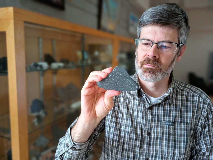 The author holding one of the Allende meteorite specimens from the Kentucky Geological Survey collection.