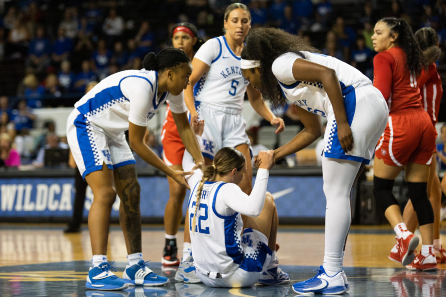 Kentucky Wildcats guard Maddie Scherr (22) gets helped up by her team during the Kentucky vs. Radford womens basketball game on Monday, Nov. 7, 2022, at Memorial Coliseum in Lexington, Kentucky. UK won 82-78. Photo by Jackson Dunavant | Staff