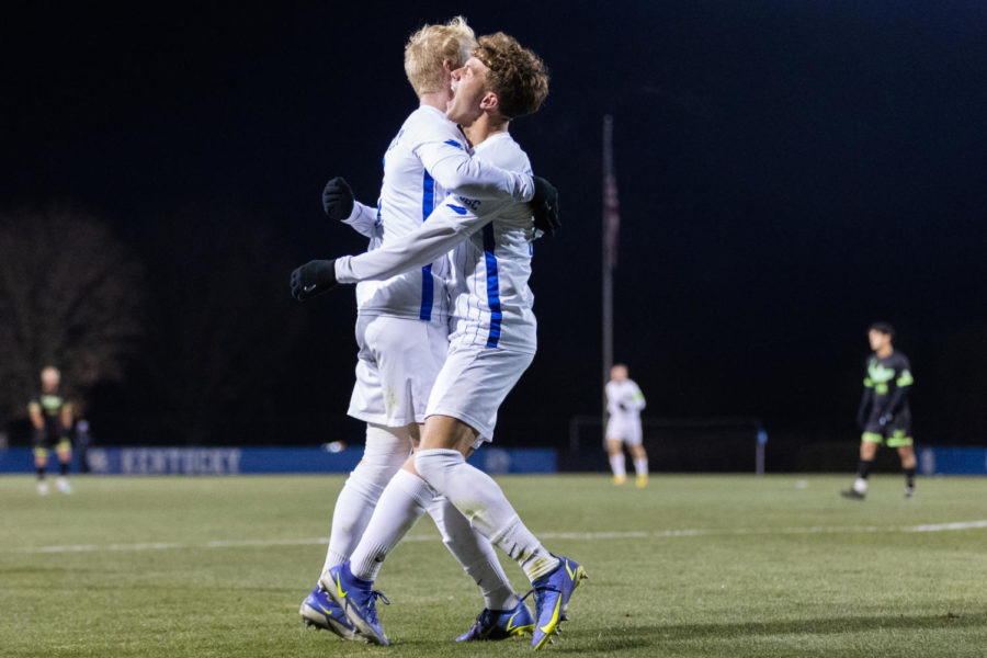 Kentucky Wildcats defenders Robert Screen (2) and Max Miller (14) celebrate after a goal during the No. 1 Kentucky vs. South Florida mens soccer match in the second round of the NCAA tournament on Sunday, Nov. 20, 2022, at the Wendell & Vickie Bell Soccer Complex in Lexington, Kentucky. Kentucky won 4-0. Photo by Jackson Dunavant | Staff