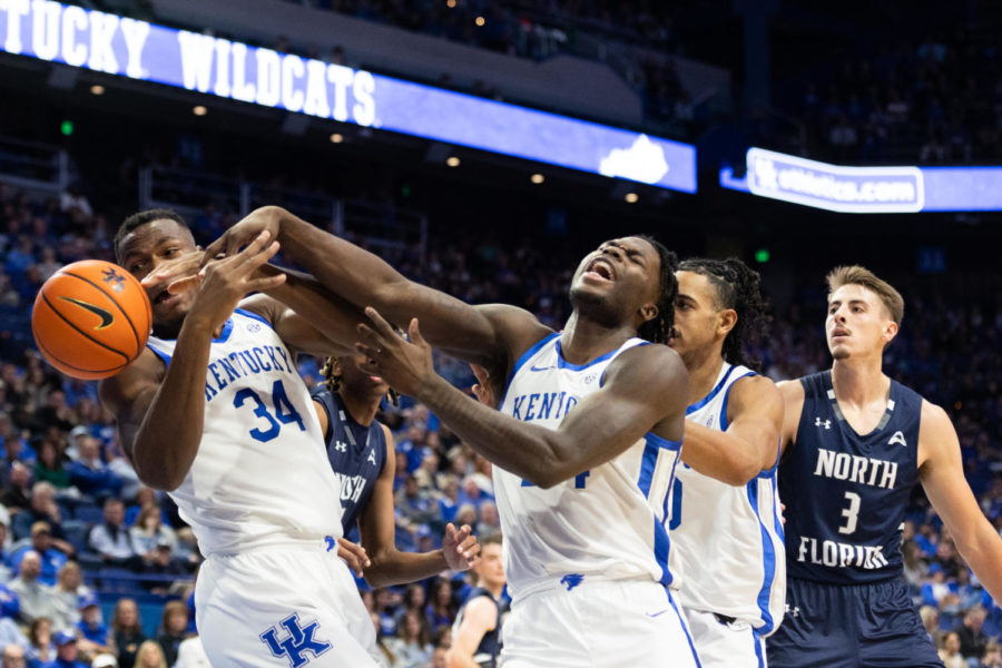Kentucky Wildcats forwards Chris Livingston (24) and Oscar Tshiebwe (34) attempt to rebound the ball during the Kentucky vs. North Florida mens basketball game on Wednesday, Nov. 23, 2022, at Rupp Arena in Lexington, Kentucky. Kentucky won 96-56. Photo by Jackson Dunavant | Staff
