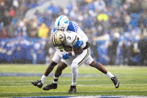 Kentucky Wildcats defensive back Tyrell Ajian (6) grabs Vanderbilt Commodores wide receiver Quincy Skinner Jr. (3) during the Kentucky vs. Vanderbilt football game on Saturday, Nov. 12, 2022, at Kroger Field in Lexington, Kentucky. UK lost 24-21. Photo by Isabel McSwain | Staff